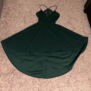 Lightly worn emerald green dress. High low. Semi-open designed back.